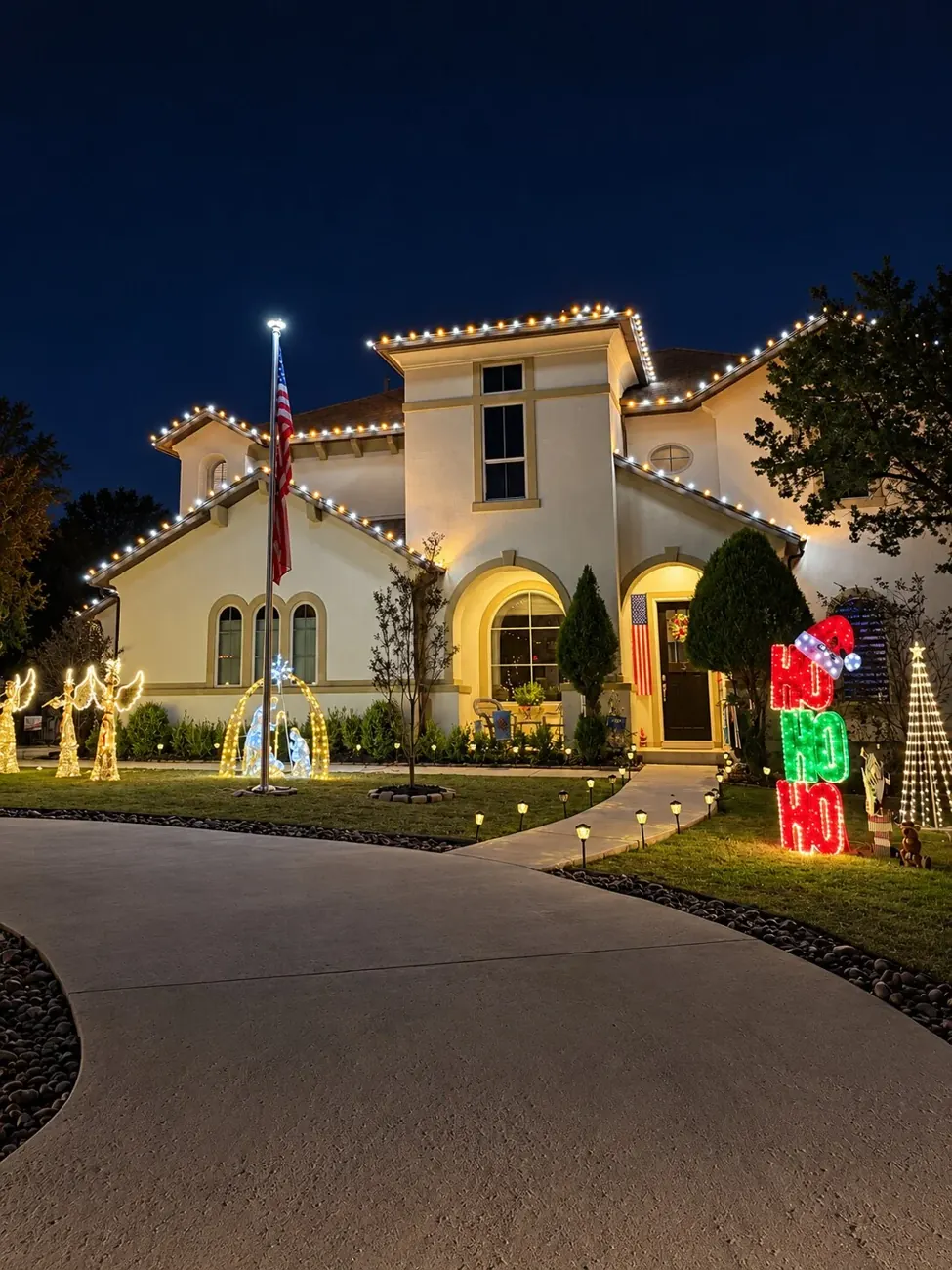 Festive Christmas lighting on a two-story home